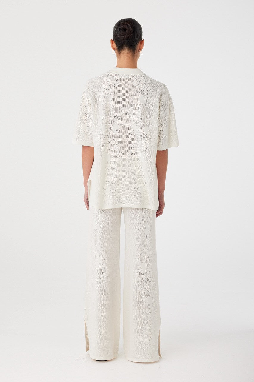 Back view of relaxed-fit shirt in custom crochet knit. Soft structure with natural movement in a hemp-cotton fabric.