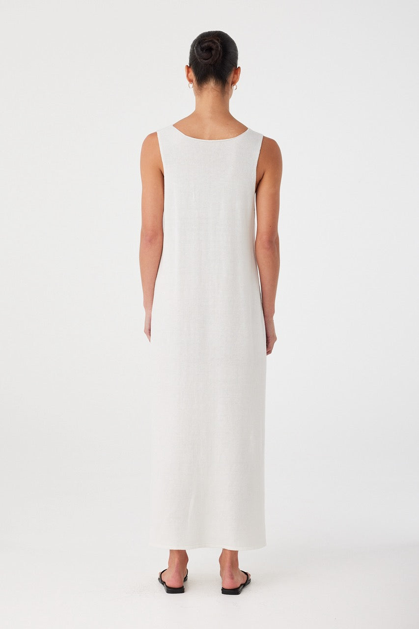 Open back cut of lightweight cream dress, crafted in a linen–cotton blend with subtle movement.