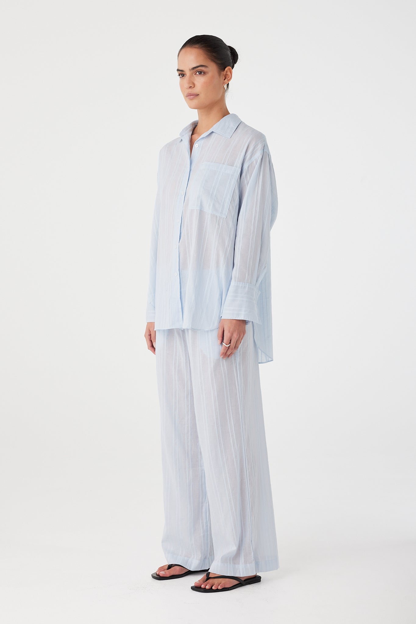 Side profile showing flowy leg and natural drape of the relaxed-fit pants.