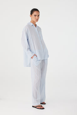 Model styling lounge-inspired pants in airy textured cotton for everyday layering.