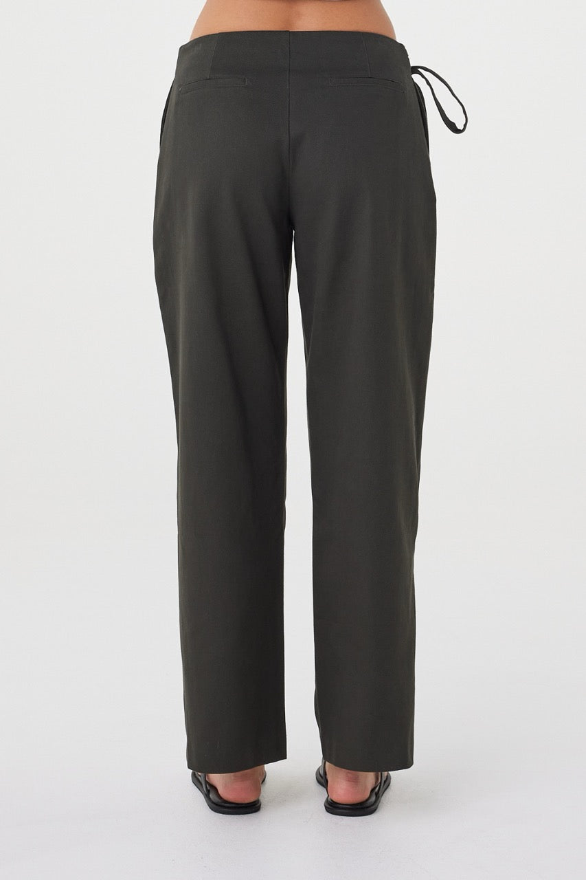 Back view of the Lucia Tie Pant in Charcoal featuring non-functional welt pockets and a clean tailored finish.
