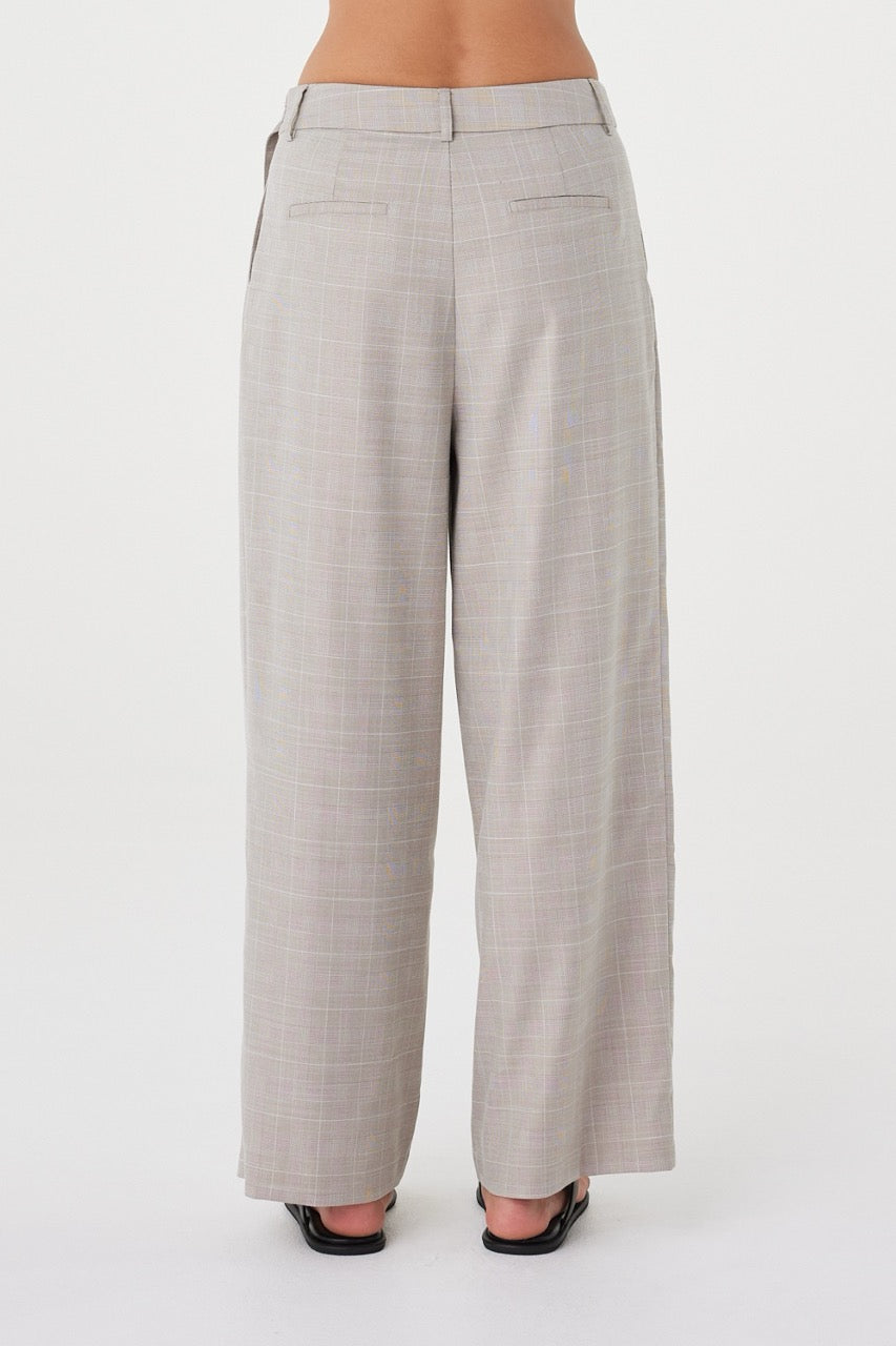 Back view of the  Calla Pant in Taupe Plaid featuring a clean tailored finish and full-length leg.