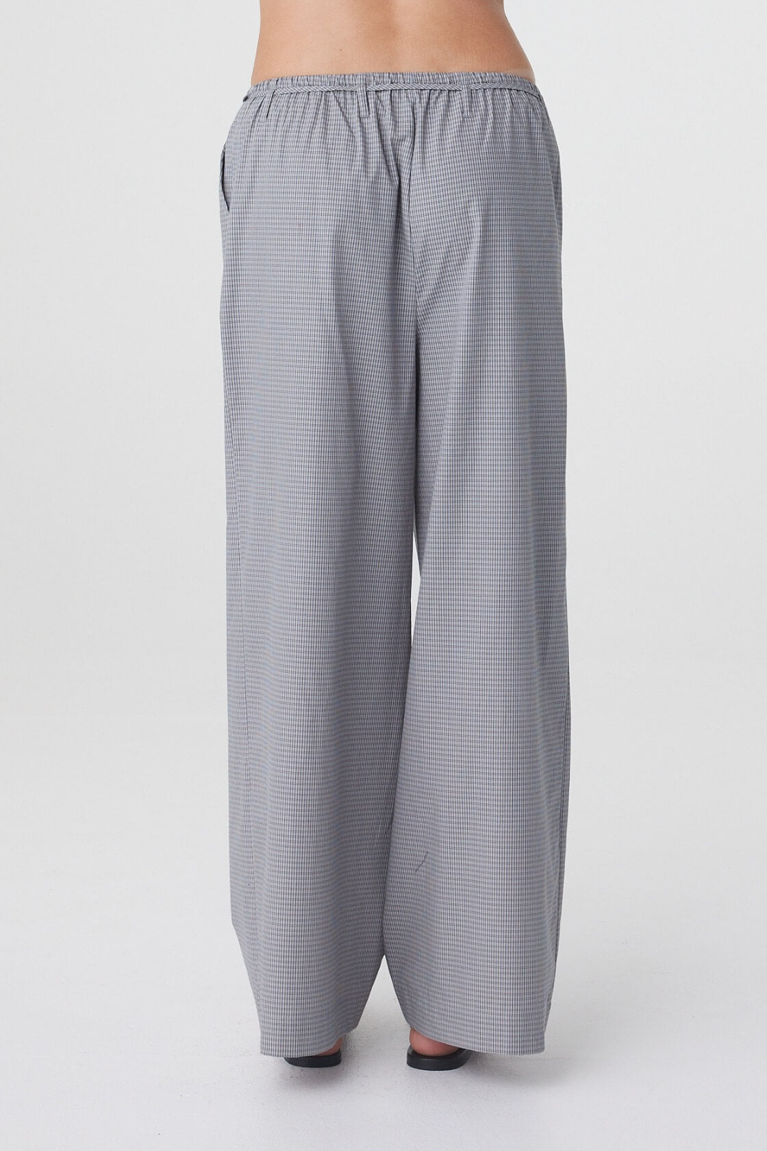 Sia Pant in Muted Blue Check, back view showing the elasticated waistband and wide leg shape.