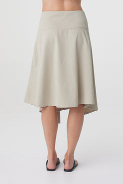 Anya Skirt in Taupe, close back view highlighting the clean waistband and godet detailing through the back.