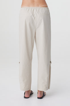 Lena Barrel Pant in Taupe, close back view showing the elasticated waistband and relaxed cropped silhouette.
