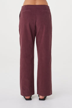 Back view of the Avery Pant in Merlot featuring a clean tailored finish and straight-leg silhouette.