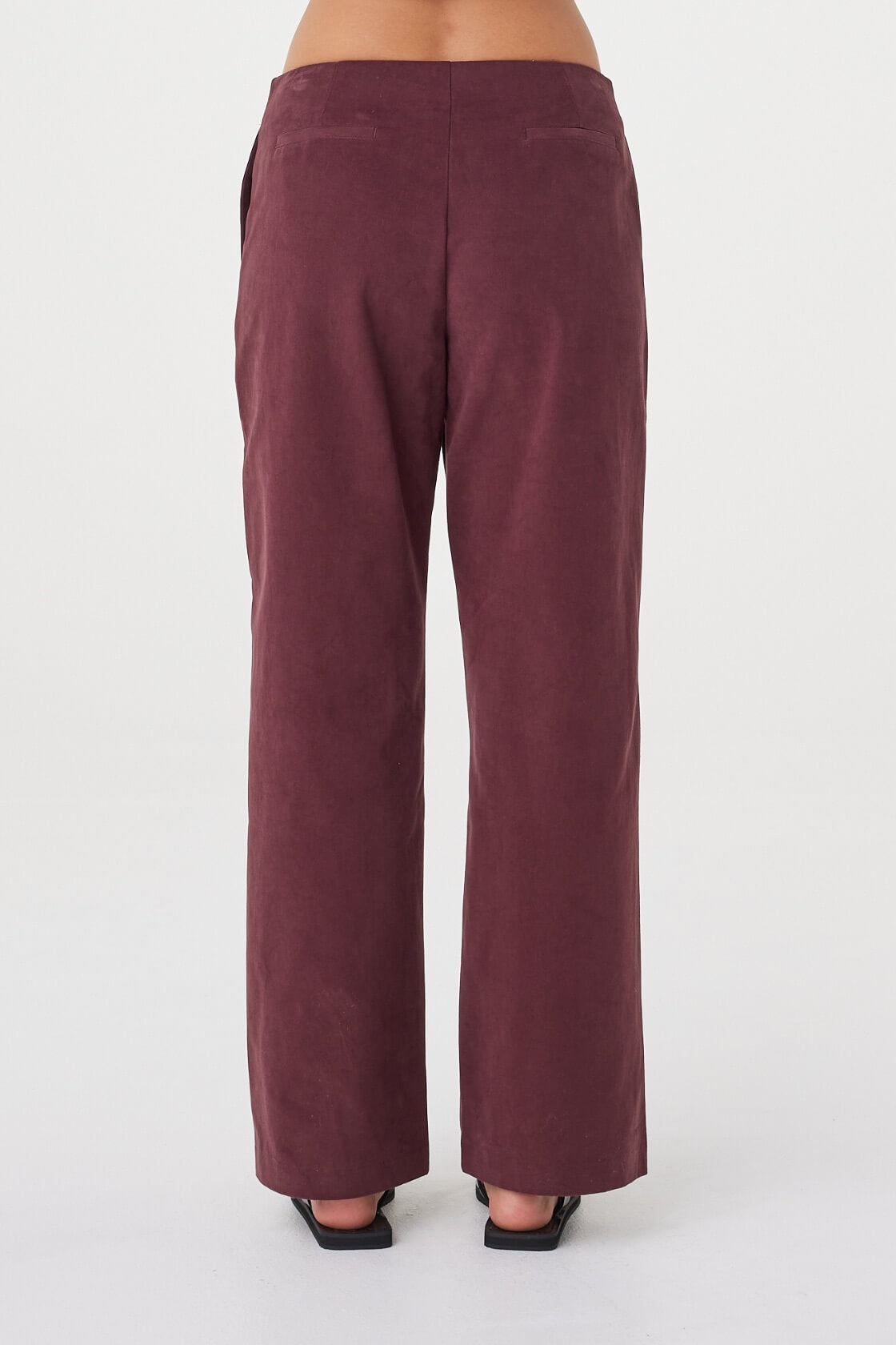 Back view of the Avery Pant in Merlot featuring a clean tailored finish and straight-leg silhouette.