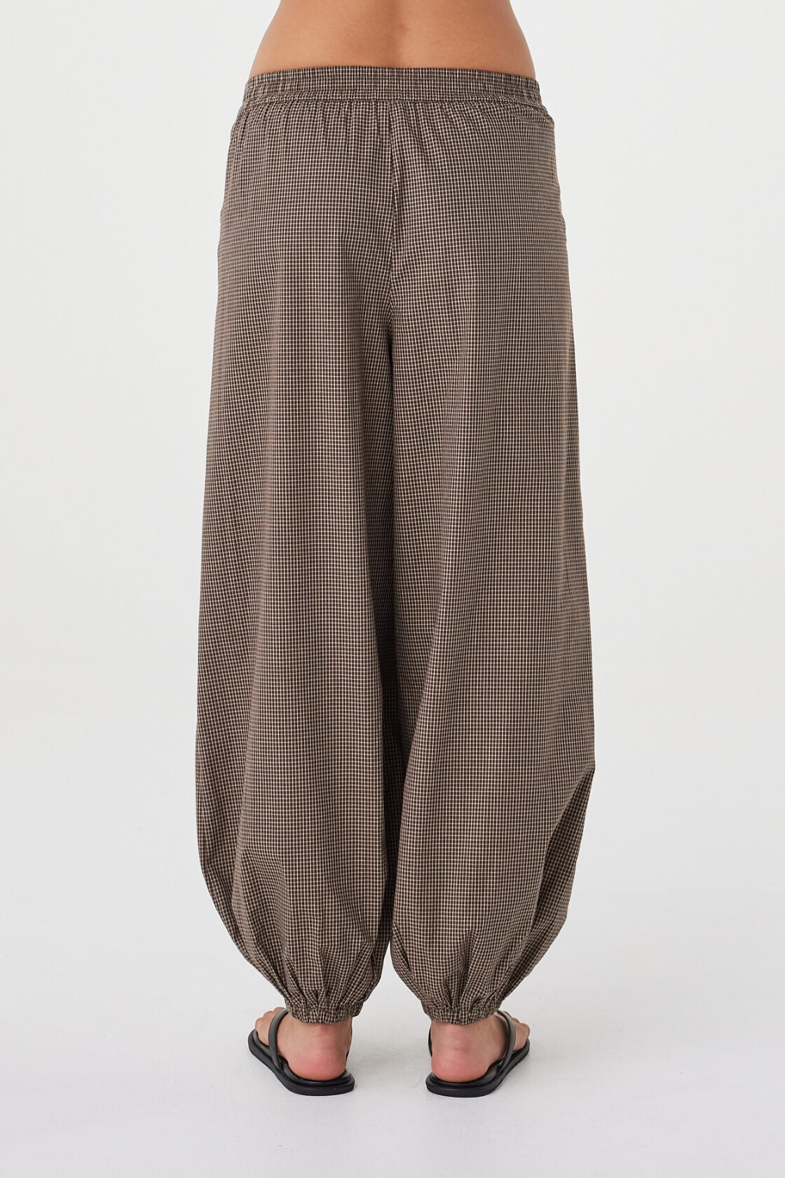 Back view of the Elina Balloon Pant in Chocolate Check highlighting the gathered balloon silhouette, elasticated back waist and micro check texture.