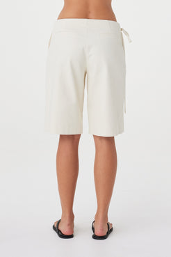 Back view of the Lucia Tie Bermuda Short in Bone showing the knee-length cut and clean relaxed silhouette.