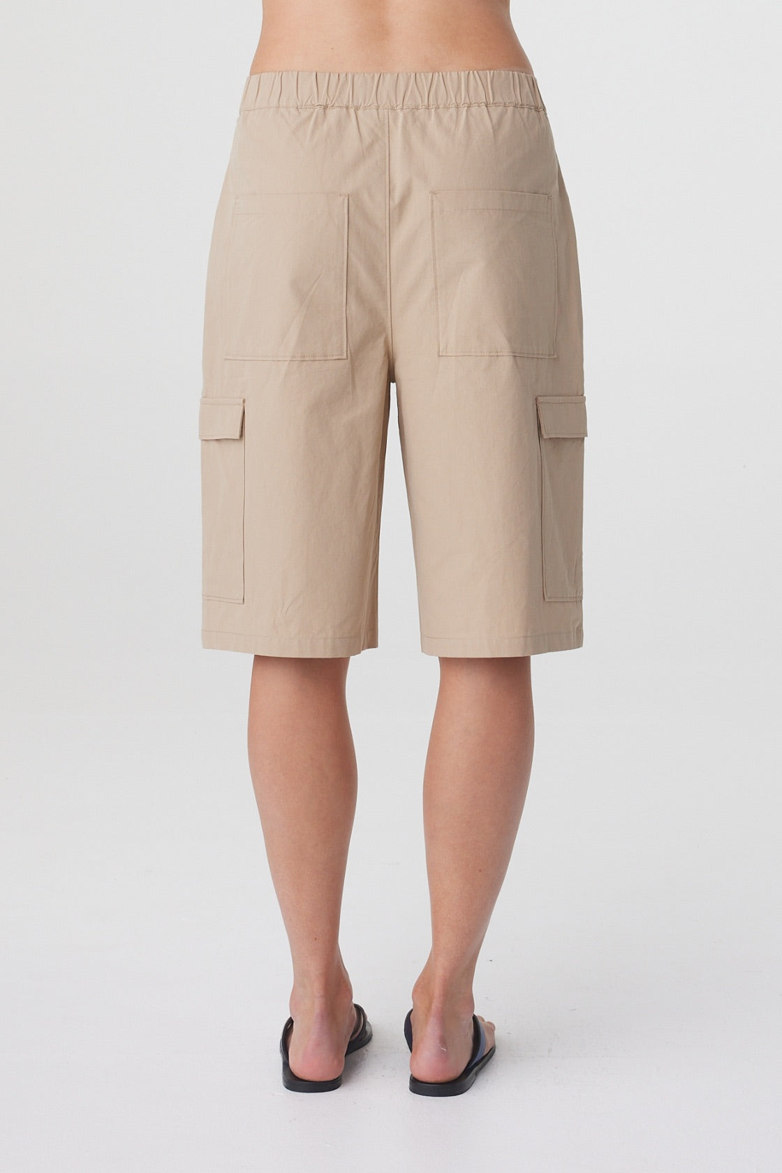 Daria Short in Camel, close back view showing the relaxed straight silhouette and cargo pockets.