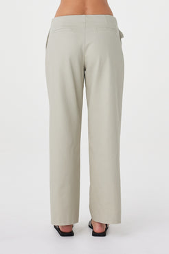 Back view of the Lucia Tie Pant in Light Sage featuring the clean back finish, non-functional welt pockets and relaxed fit.