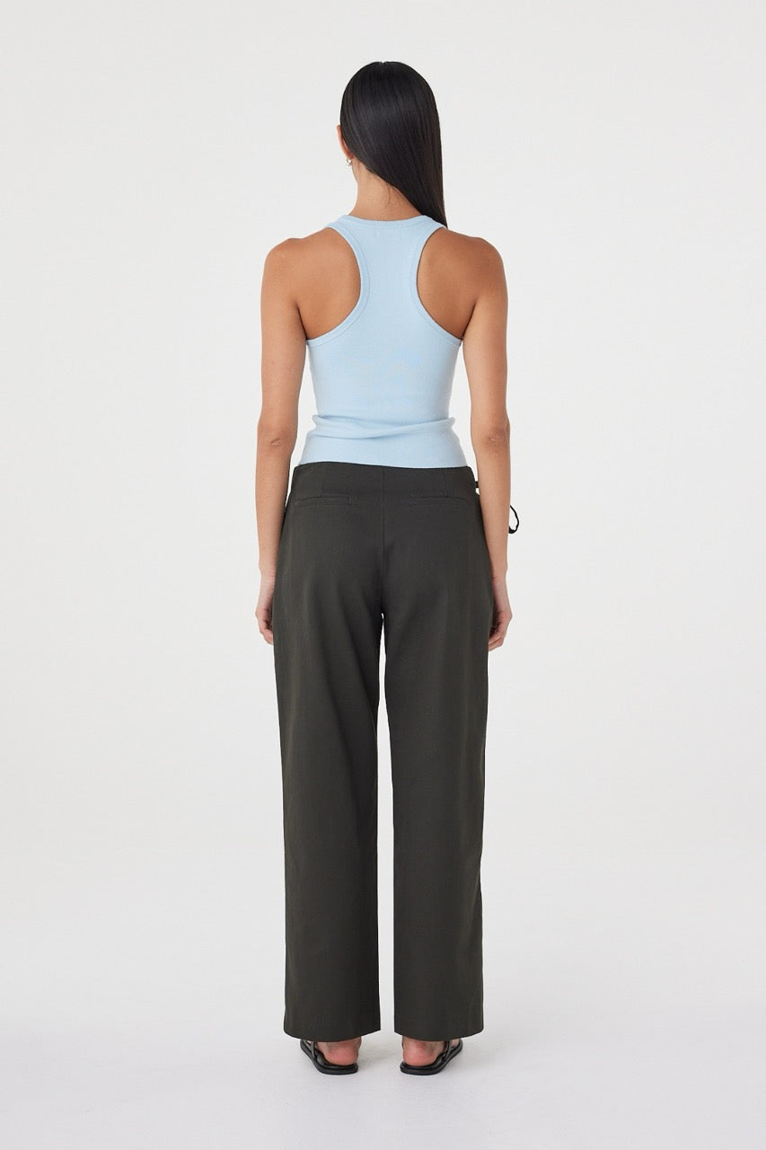 Rear three-quarter view of the Lucia Tie Pant in Charcoal featuring the clean back finish and relaxed tailored shape.