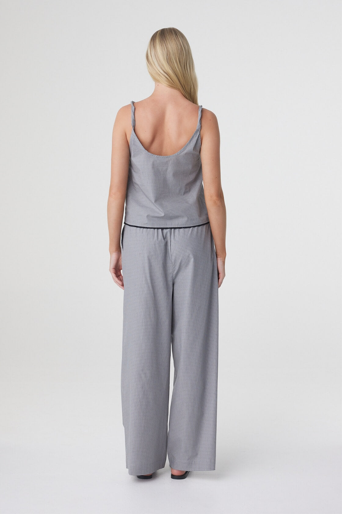 Sia Pant in Muted Blue Check styled with the matching top, back view showing the full length wide leg silhouette.
