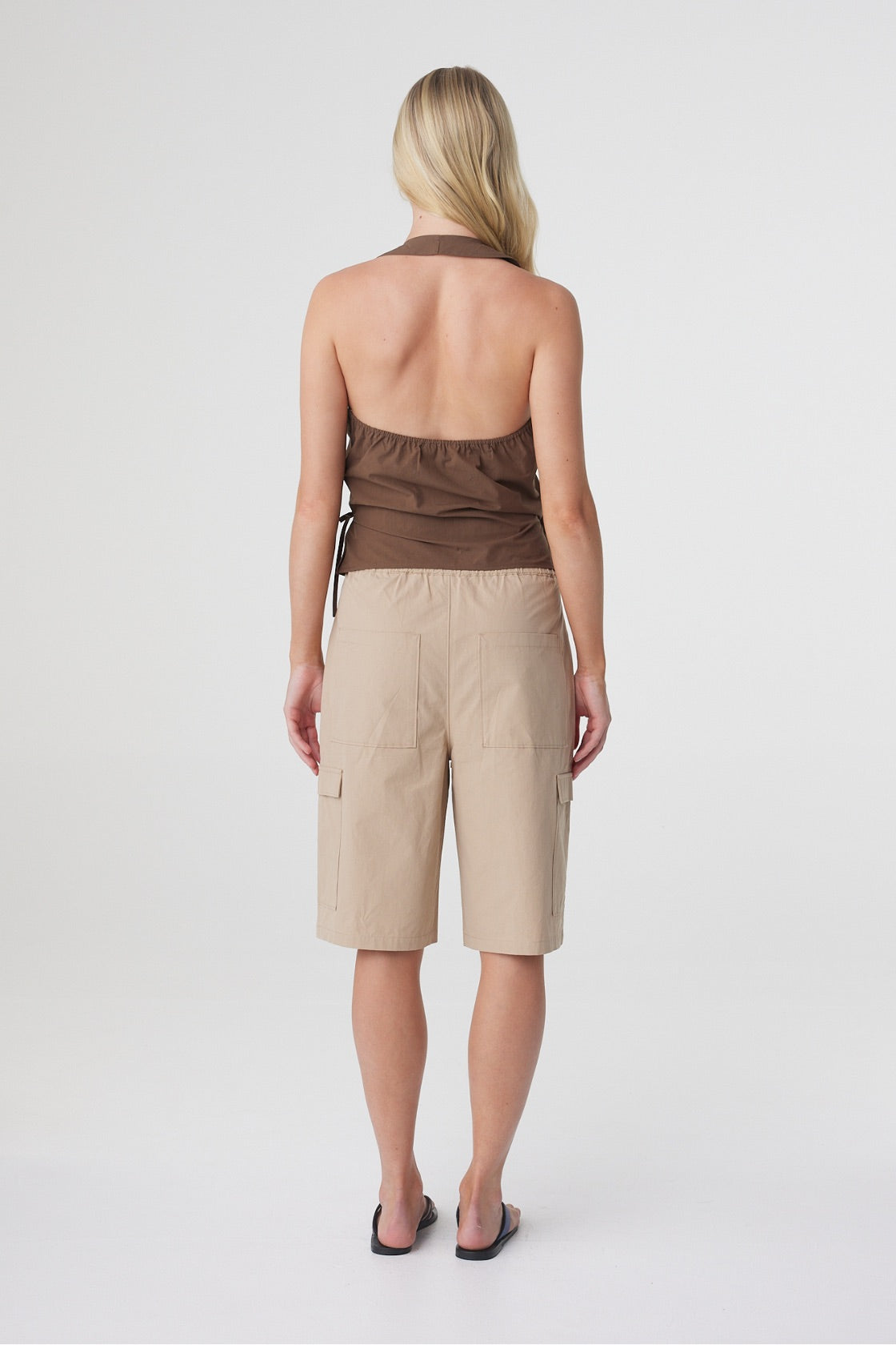Daria Short in Camel, back view showing the elasticated waistband and loose fit through the leg.