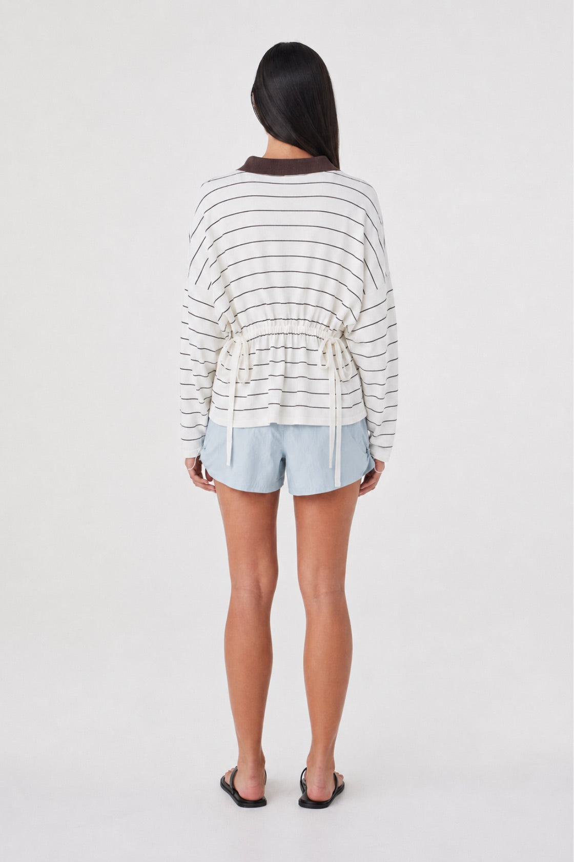 Back view of the Addie Short in Pale Blue featuring the relaxed silhouette and elasticated waistband.