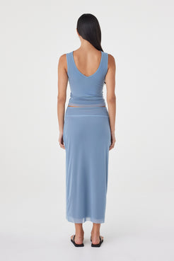 Back view of the Eden Reversible Skirt in Pale Blue & Espresso featuring the pale blue side, clean finish and slim silhouette.