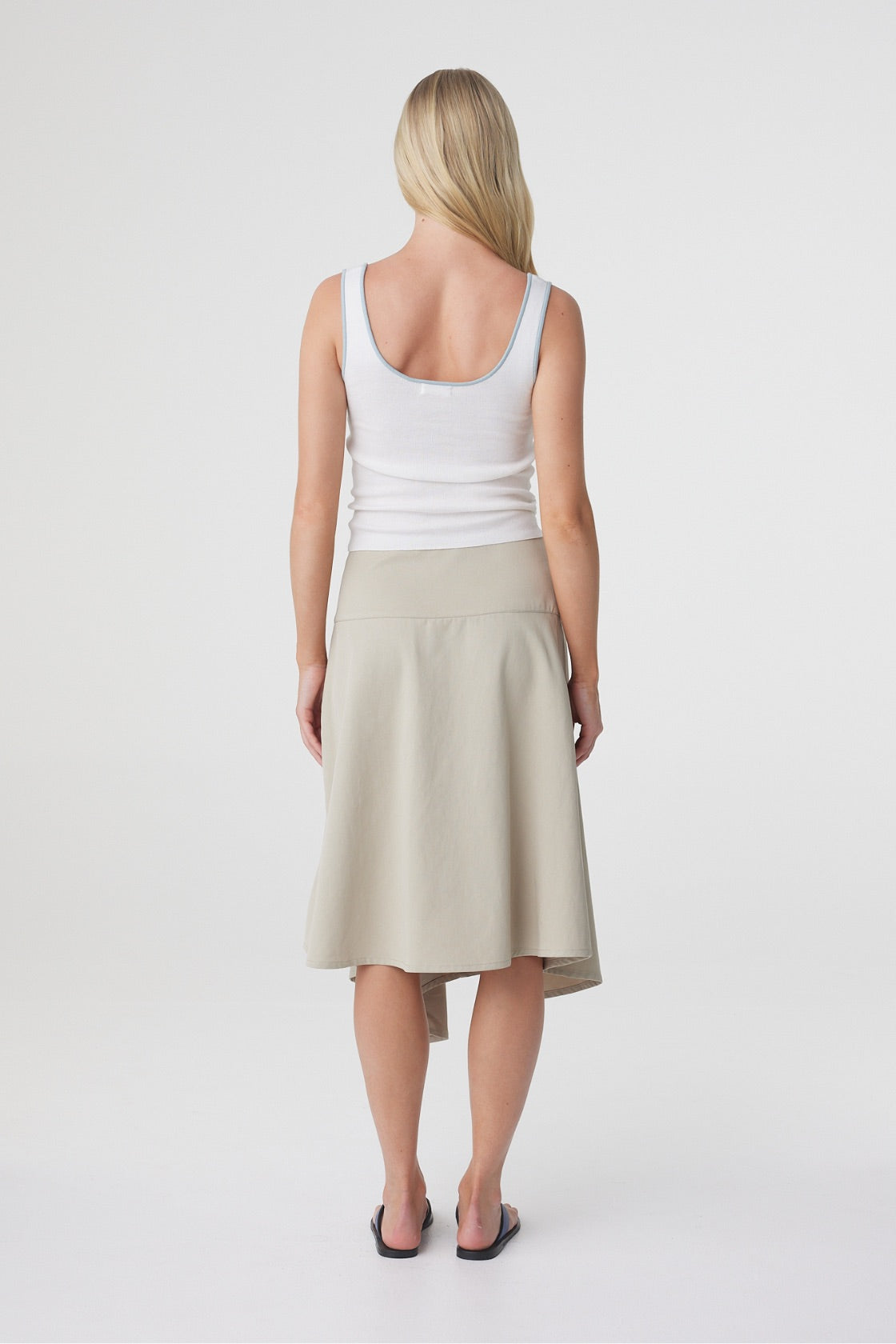 Anya Skirt in Taupe, full back view highlighting the deep waistband and softly flared shape through the skirt.