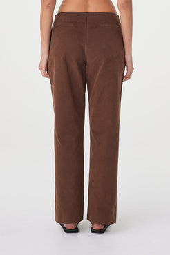 Close-up back view of the Avery Pant in espresso highlighting the velvet-textured cotton fabrication, clean waist finish and subtle tailored detailing through the back