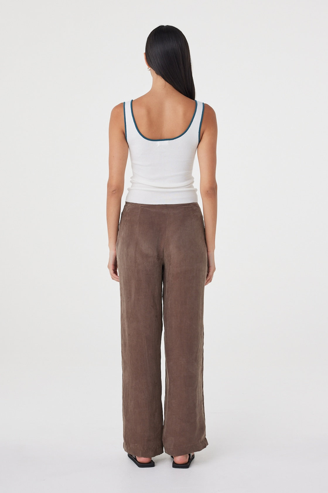 Back view of the Kaya Tank in Cream & Teal featuring the scoop back, slim fit and contrast teal trim.