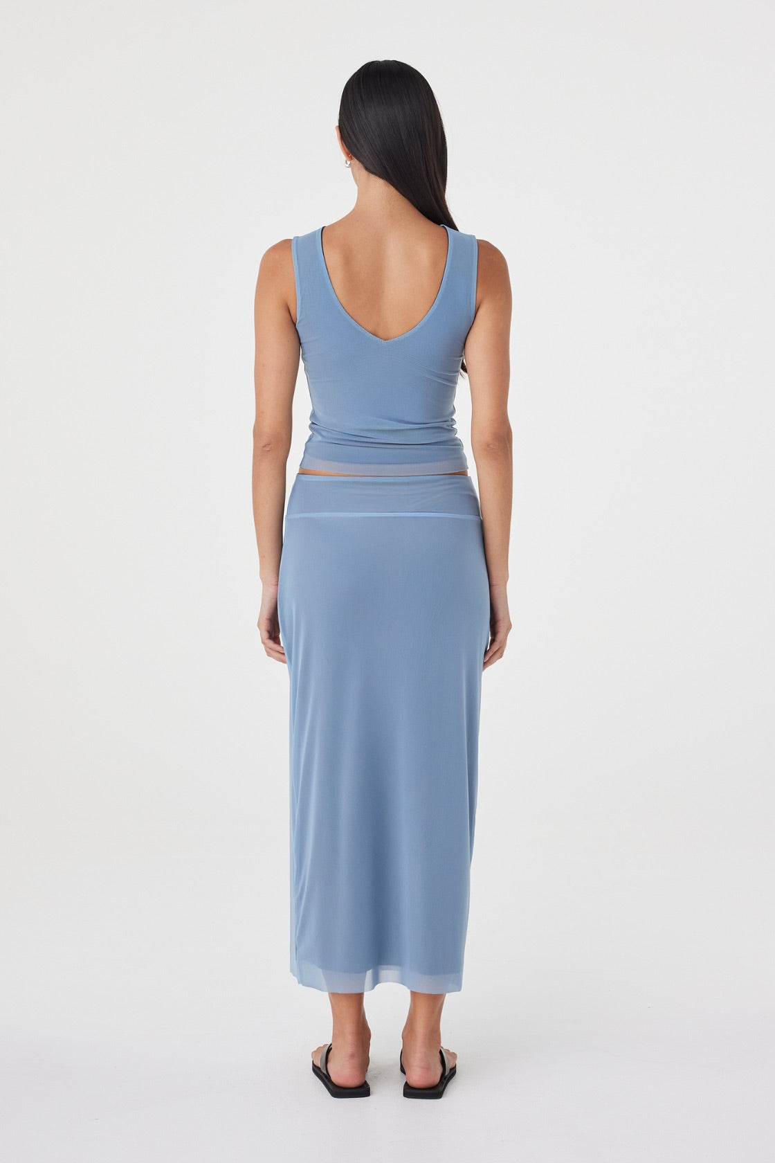 Back view of the Eden Reversible Top in Pale Blue & Espresso showcasing the fitted silhouette, clean finish and pale blue reverse side.