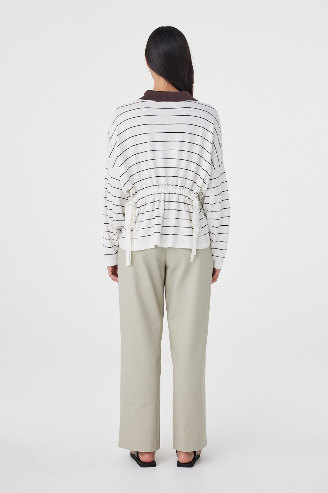 Back view of the Zia Tie Knit Jersey in Cream & Espresso showcasing the horizontal stripe design and adjustable back waist ties.