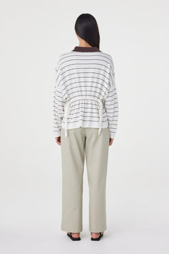 Back view of the Zia Tie Knit Jersey in Cream & Espresso showcasing the horizontal stripe design and adjustable back waist ties.