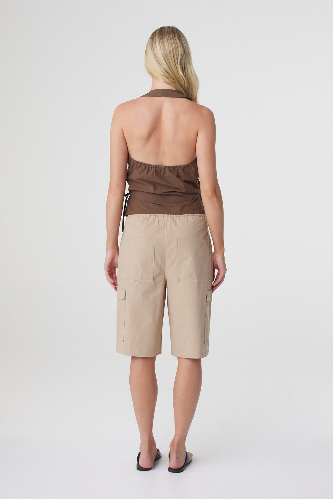 Lilia Wrap Top in Espresso, back view showing the open halter back and elasticated top edge.