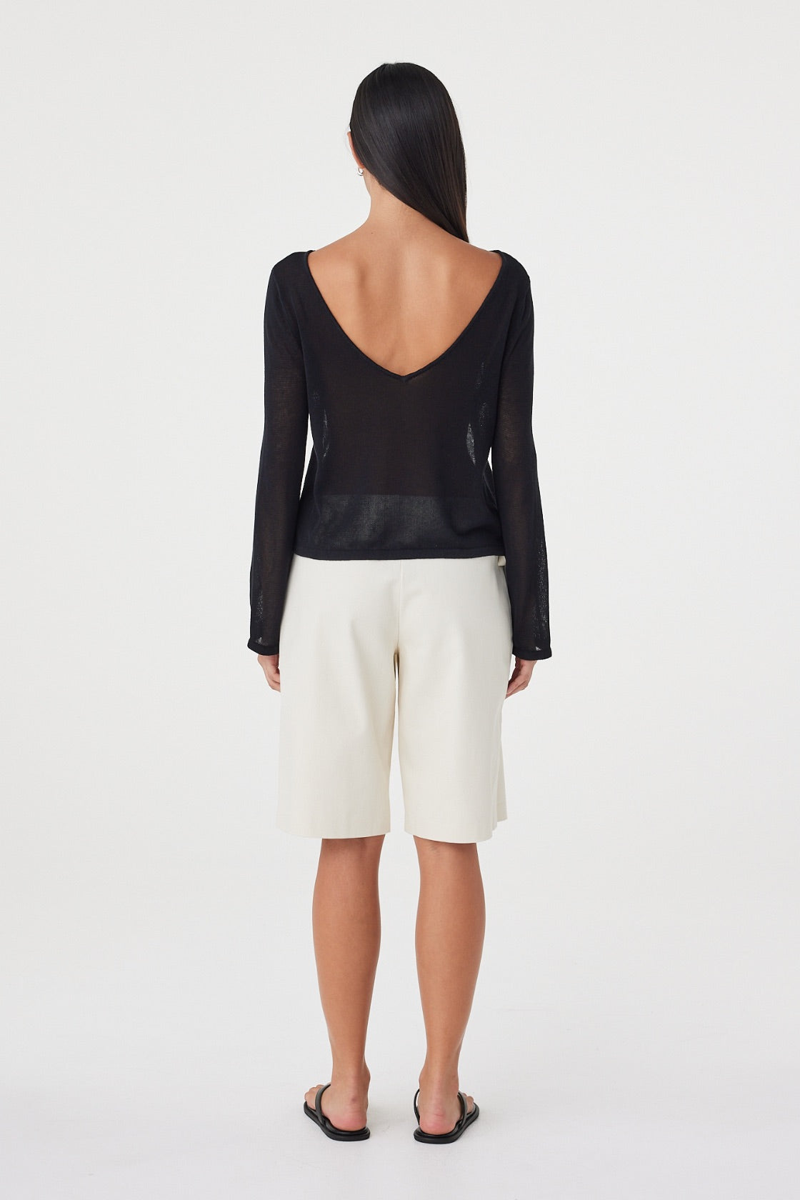 Back view of the Nia LS Top in Black showing the low, wide neckline and relaxed fit through the body.