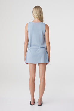 Clara Mini Dress in Dusk Blue, back view showing the relaxed straight silhouette and sleeveless back.