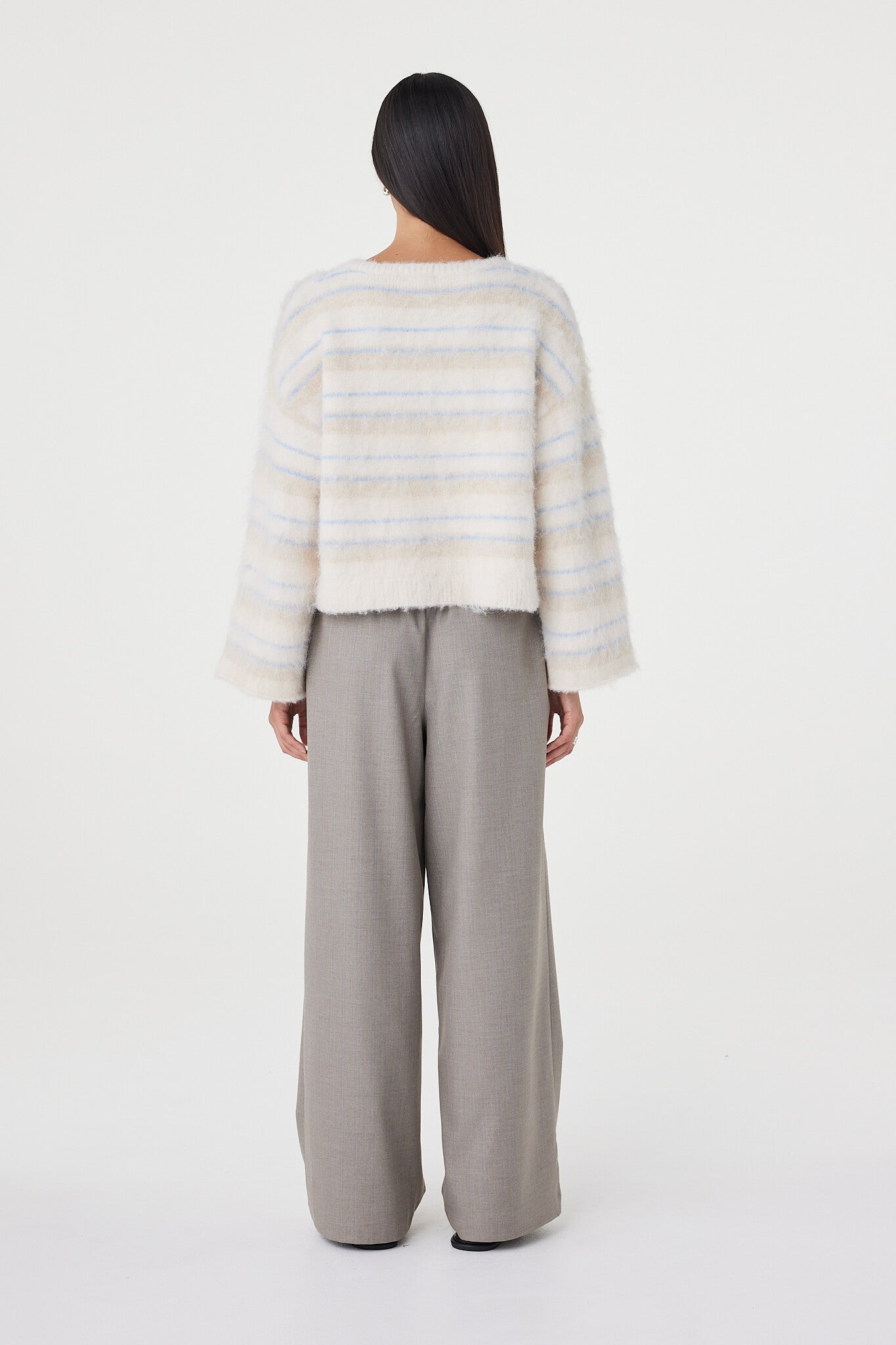 Back view of the Lucca Sweater in taupe and blue stripe showcasing the custom horizontal stripe artwork, relaxed oversized fit and fluffy brushed knit finish

