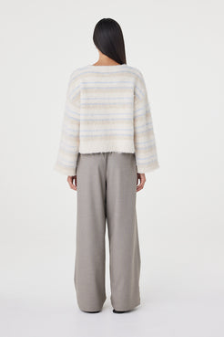 Back view of the Lucca Sweater in taupe and blue stripe showcasing the custom horizontal stripe artwork, relaxed oversized fit and fluffy brushed knit finish
