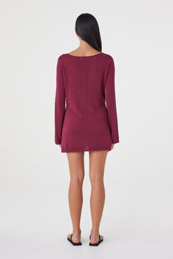 Back view of the Kira Mini Dress in Merlot featuring the clean silhouette, long sleeves and relaxed fit.