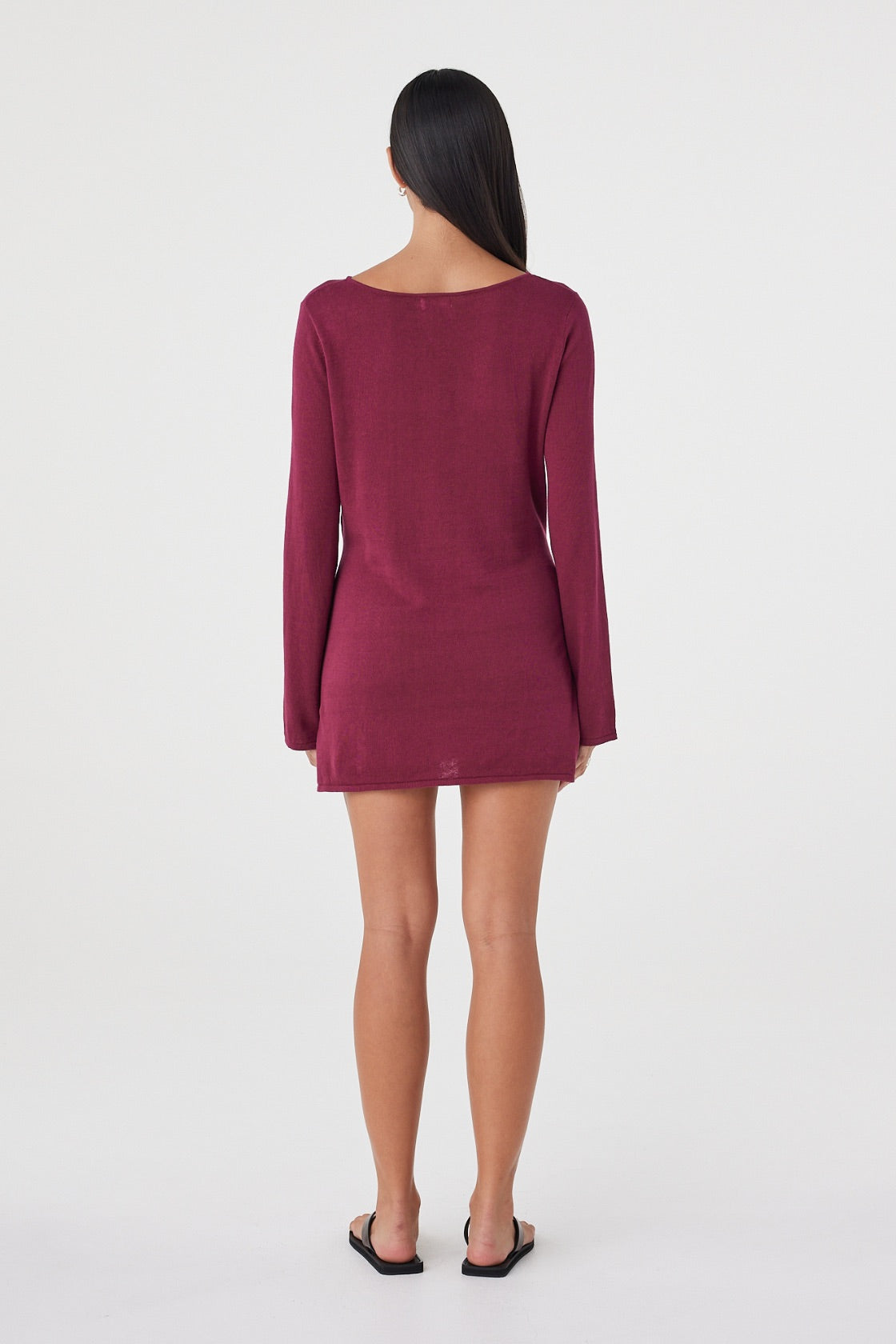 Back view of the Kira Mini Dress in Merlot featuring the clean silhouette, long sleeves and relaxed fit.