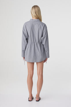 Back view of the Sia Shirt in Muted Blue Check, showing the oversized silhouette and long shirt length.