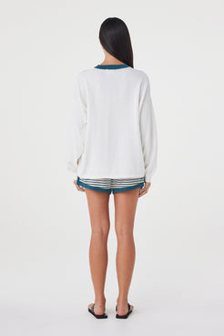 Back view of the Cammy LS Tee in Cream & Teal featuring the relaxed off-body fit, long sleeves and back yoke detailing.