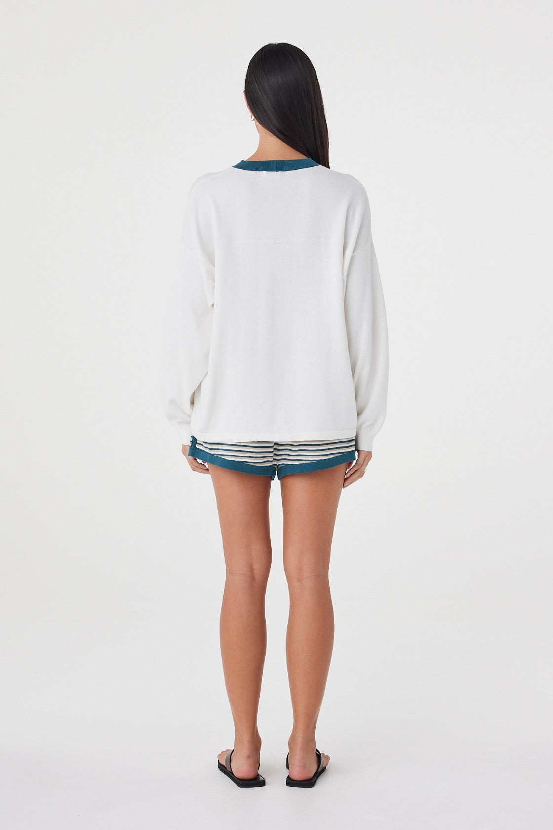 Back view of the Cammy LS Tee in Cream & Teal featuring the relaxed off-body fit, long sleeves and back yoke detailing.