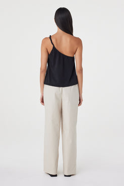 Back view of the Harri Asym Top in Black featuring the asymmetric shoulder line and relaxed silhouette through the body.