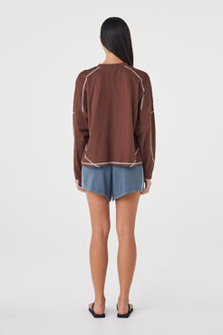 Back view of the Kesh LS Tee in Espresso & Cream showcasing the relaxed silhouette, dropped shoulders and contrast overlocking throughout.