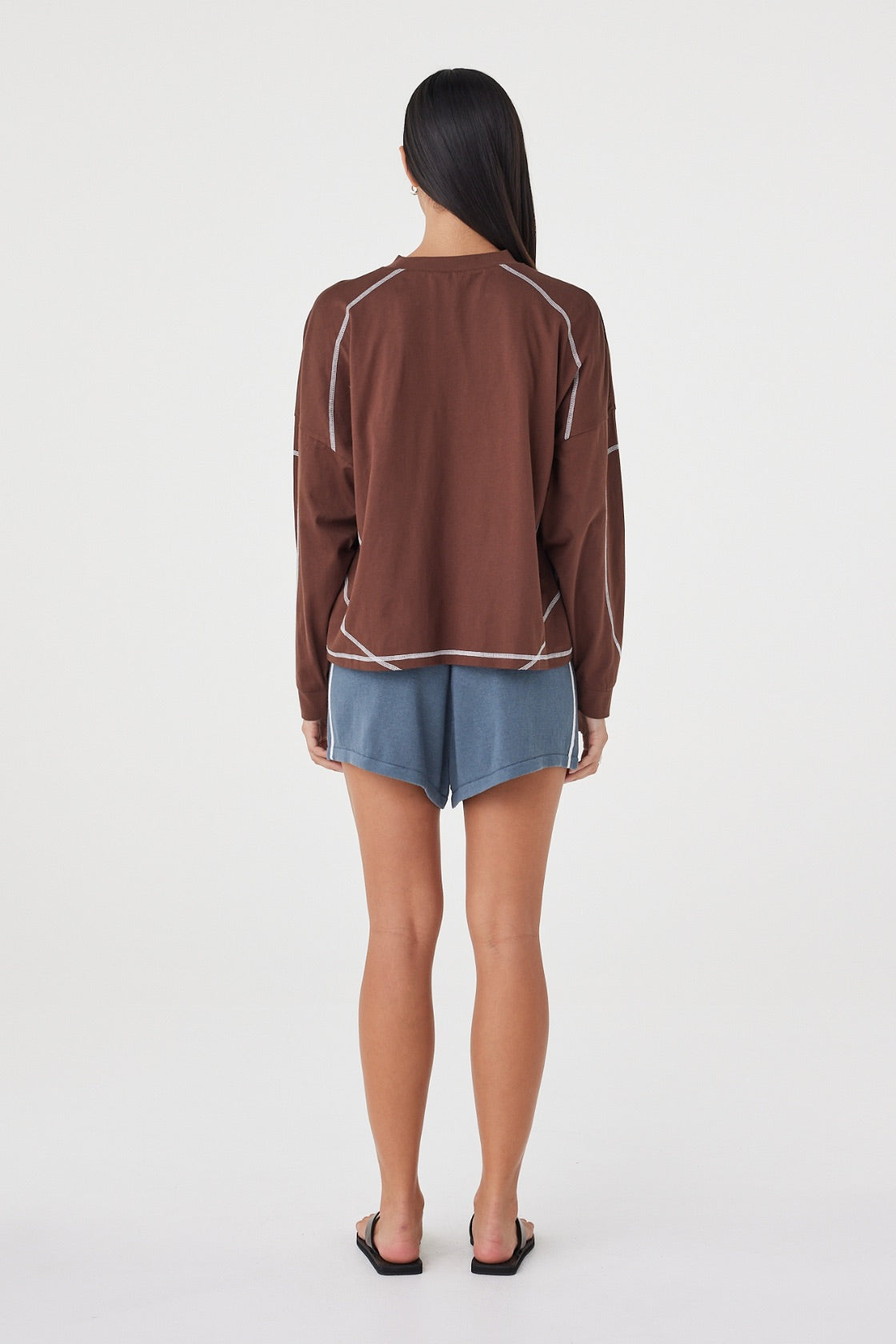 Back view of the Kesh LS Tee in Espresso & Cream showcasing the relaxed silhouette, dropped shoulders and contrast overlocking throughout.