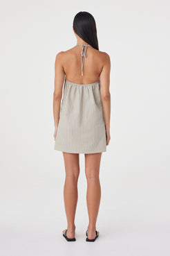 Back view of the Joni Mini Dress in Taupe Stripe highlighting the open halter-style back and clean A-line shape.