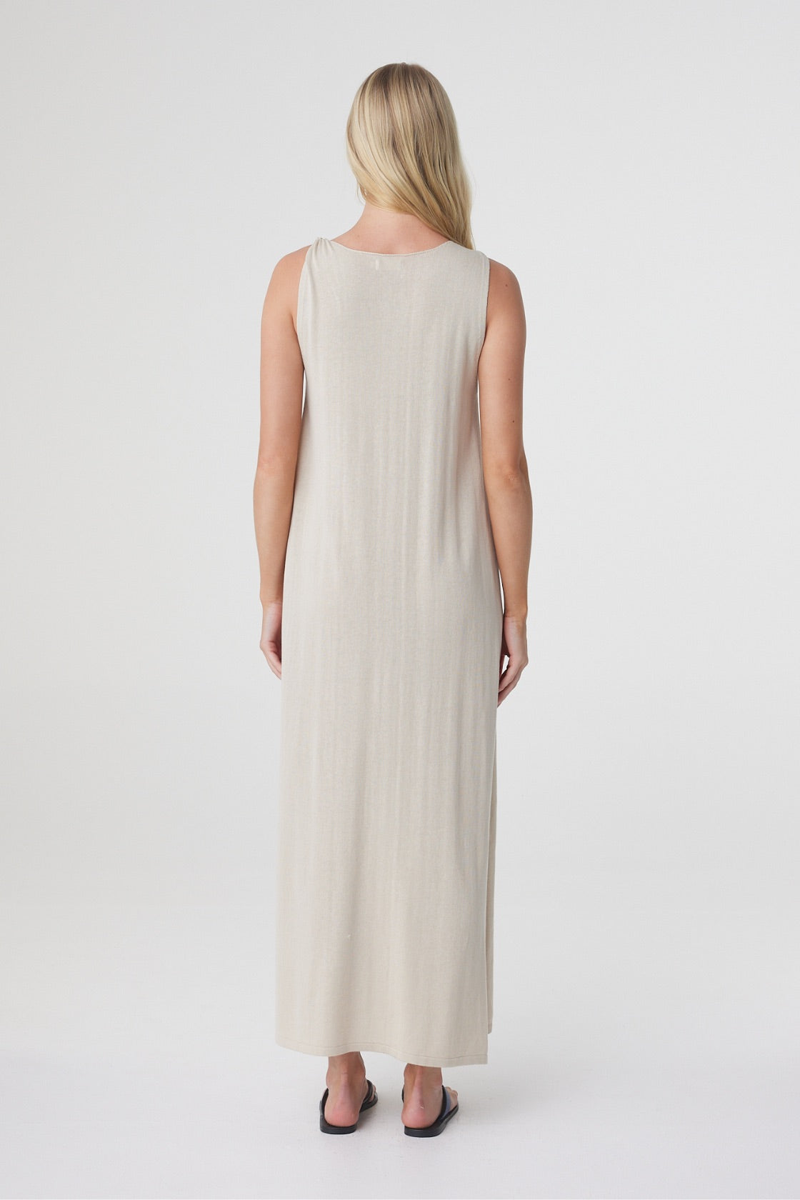 Clara Maxi Dress in Taupe, back view showing the relaxed sleeveless shape and full maxi length.