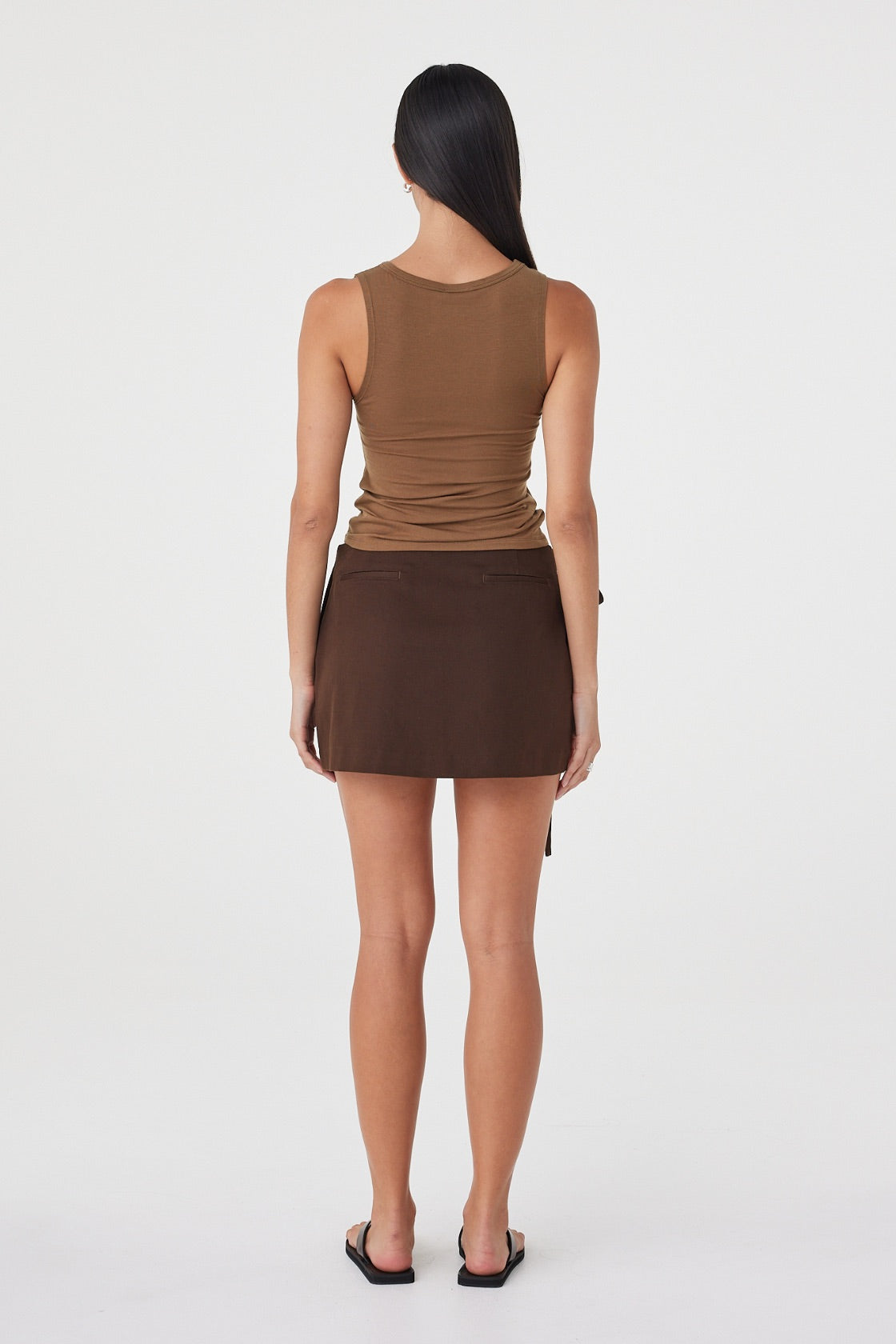 Back view of the Mable Tank in Deep Cedar showcasing the clean sleeveless design and streamlined silhouette. 