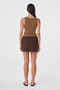 Back view of the Lucia Tie Mini Skirt in Espresso showing the clean mini silhouette and streamlined fit through the waist and hip.