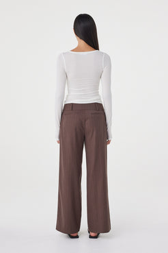 Back view of the Mabel LS Twist Top in Cream showcasing the smooth fitted silhouette and lightweight stretch knit construction.
