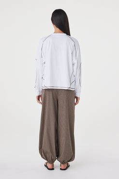 Back view of the Kesh LS Tee in Cream & Espresso showcasing the relaxed silhouette, dropped shoulders and contrast overlocking throughout.