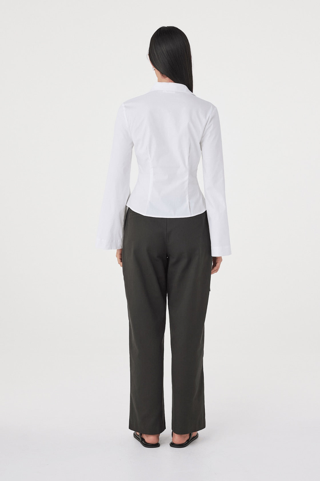 Back view of the Ari Shirt in White featuring a tailored fit, back princess seams and clean minimalist finish.