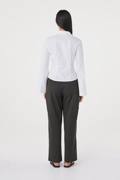 Back view of the Ari Shirt in White featuring a tailored fit, back princess seams and clean minimalist finish.