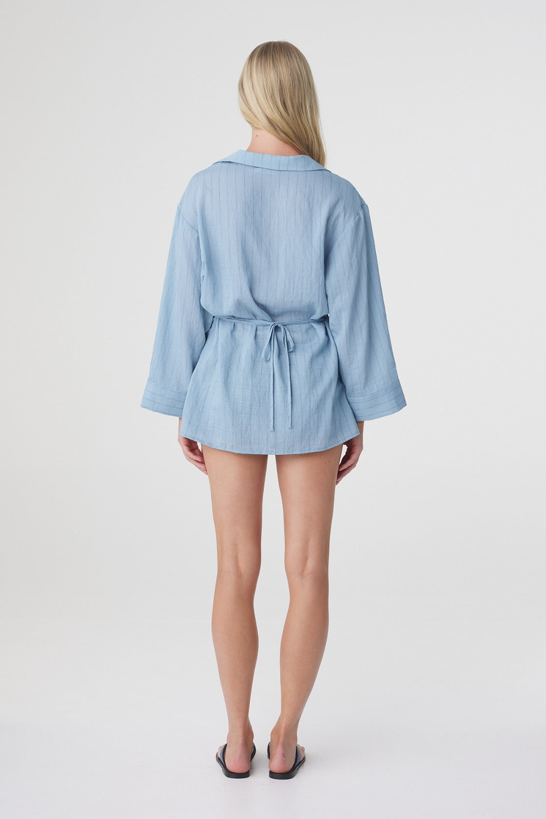 Amara Shirt Dress in Dusk Blue Stripe, back view highlighting the oversized shape, gathered waist and relaxed long sleeves.