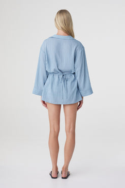 Amara Shirt Dress in Dusk Blue Stripe, back view highlighting the oversized shape, gathered waist and relaxed long sleeves.
