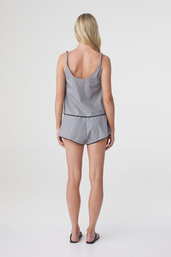 Allie Top in Muted Blue Check, back view styled with matching shorts, showing the deep back neckline, twisted straps and relaxed fit.